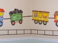 childrens-murals-train-whimsical-animal-train-over-crib-with-tracks-going-around-room-as-border