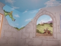 childrens-murals-castle-big-friendly-green-dragon-looking-over-a-broken-castle-wall-with-window-scene-of-knight-riding-to-defend-his-castle
