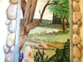 residential-murals-window-stone-window-with-kitty-looking-out-to-garden